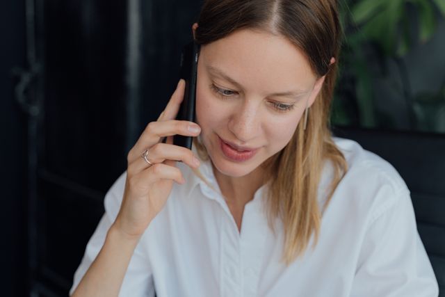 a person holding a smartphone to their ear