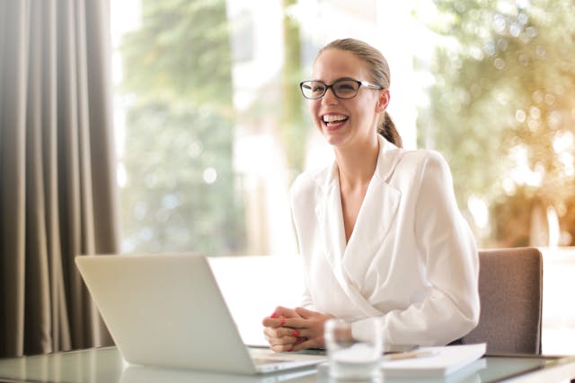 person smiling at desk